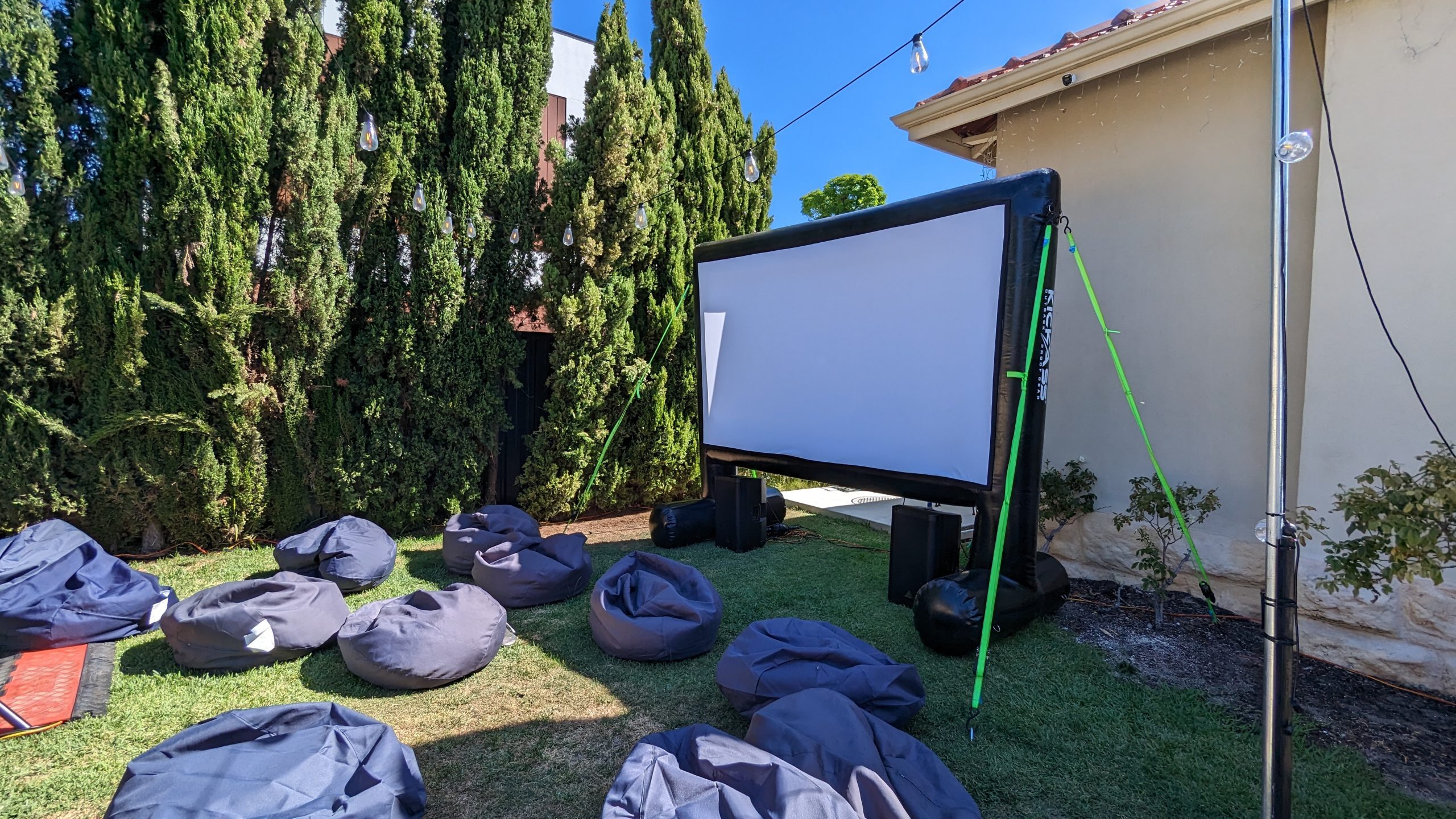 Outdoor cinema hire Perth — backyard movie night setup with inflatable screen
